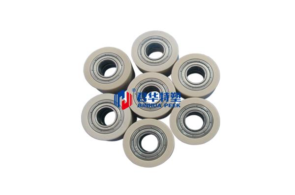 Rouleau de roulement à revêtement caoutchouc PEEK